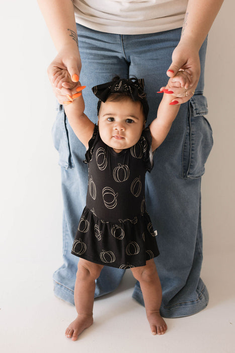 forever french baby Bamboo Ruffle Romper | Midnight Pumpkin